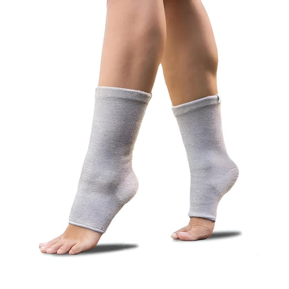 Pair of legs wearing grey ankle compression sleeves on white background, IndianChic product