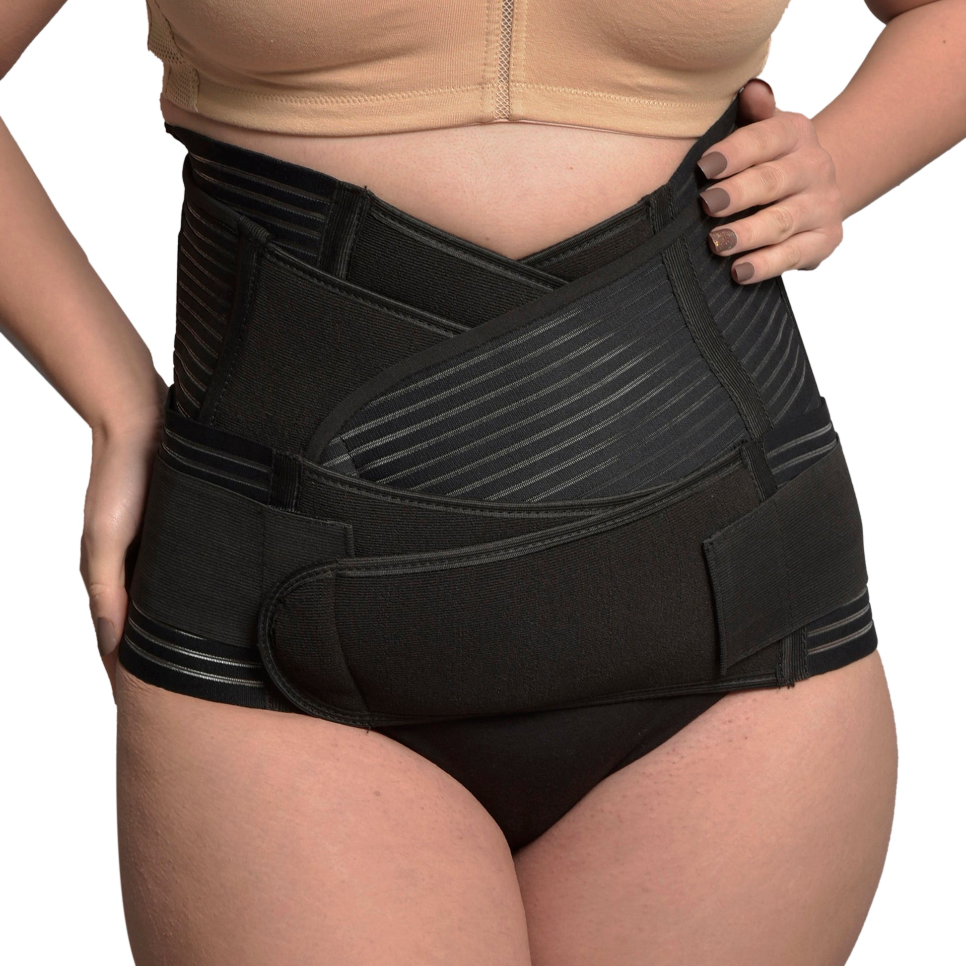 Woman wearing black 3-in-1 postnatal shapewear belly support belt